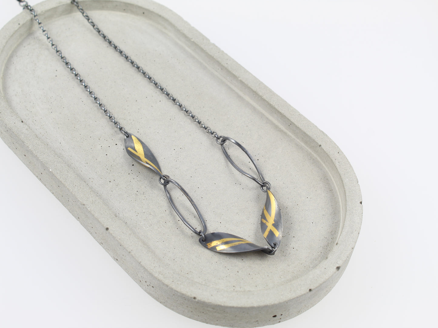 Oxidised Twisted Olive Leaf necklace with gold detail