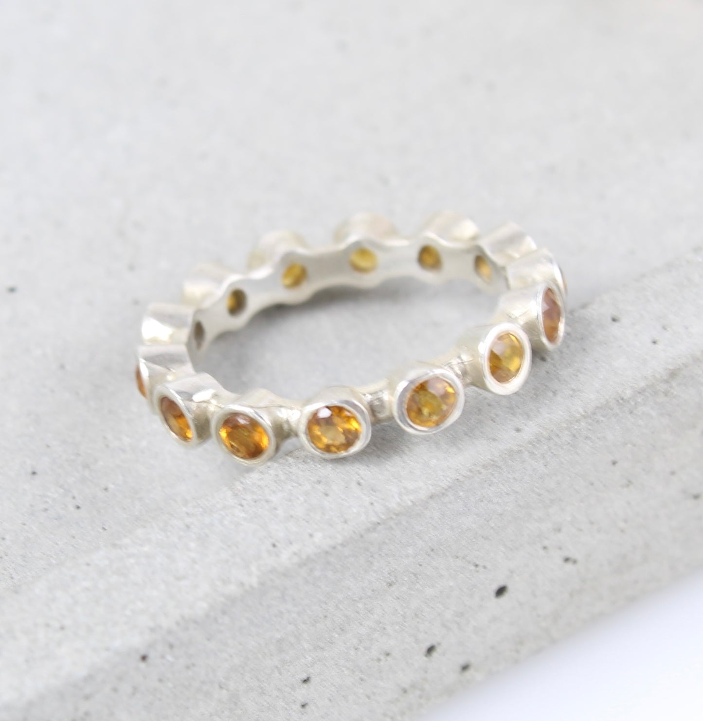 Silver and citrine eternity ring