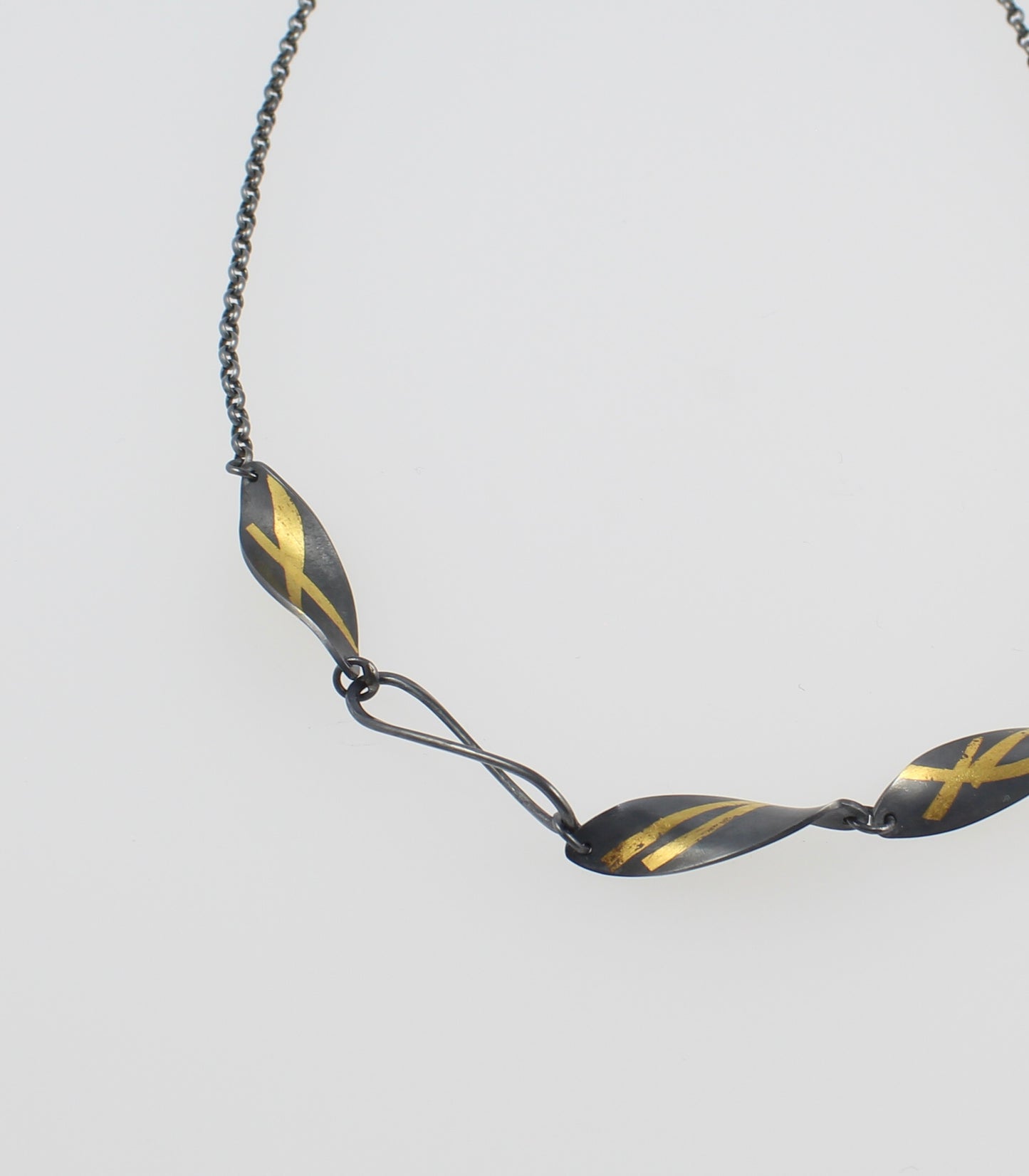 Oxidised Twisted Olive Leaf necklace with gold detail