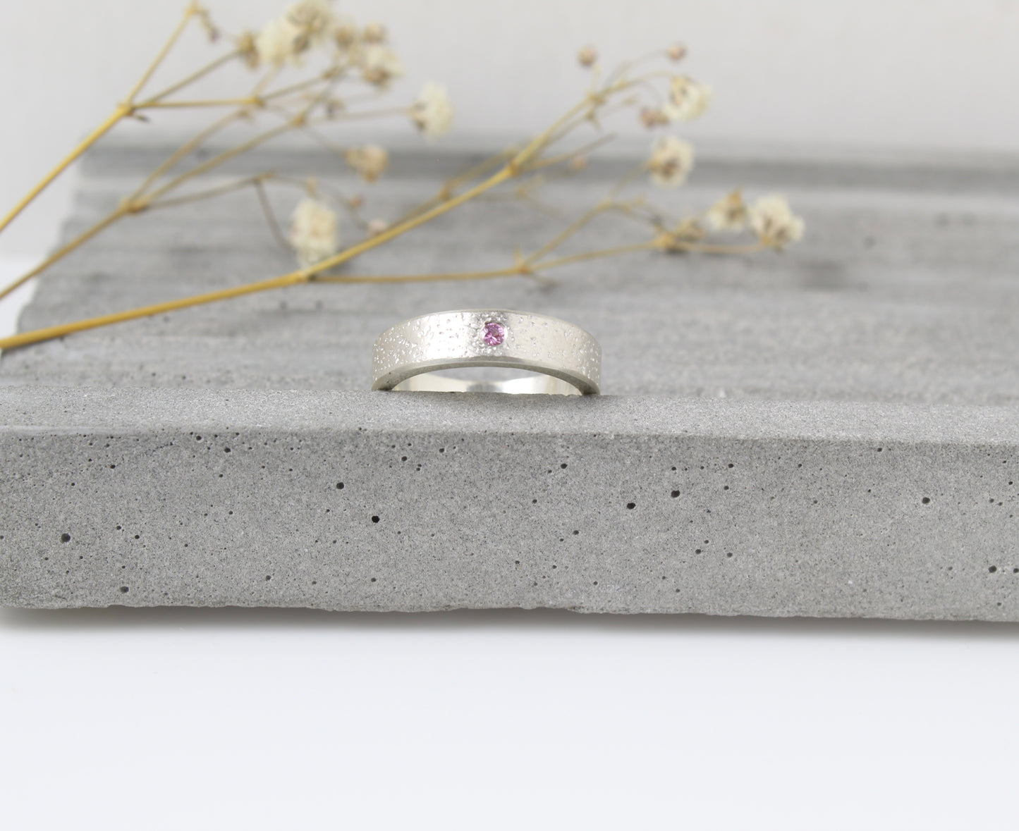 Silver sand textured ring band with pink sapphire