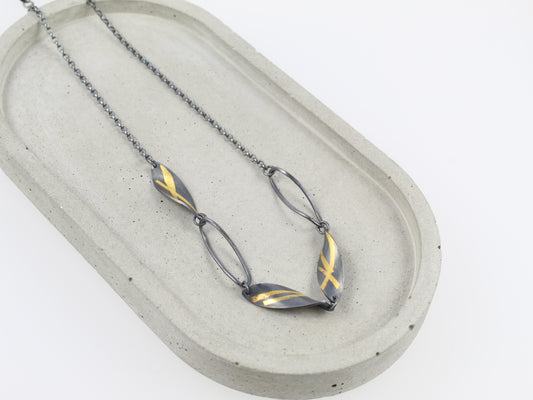 Oxidised Twisted Olive Leaf necklace with gold detail