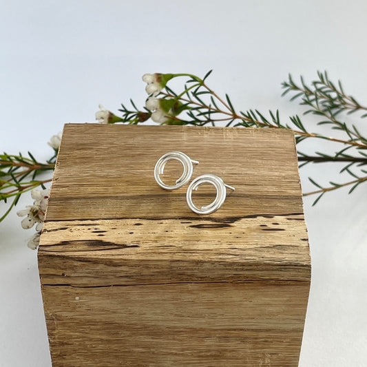 Silver circular stud earrings