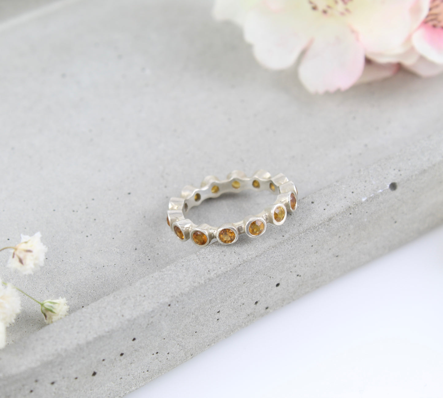 Silver and citrine eternity ring