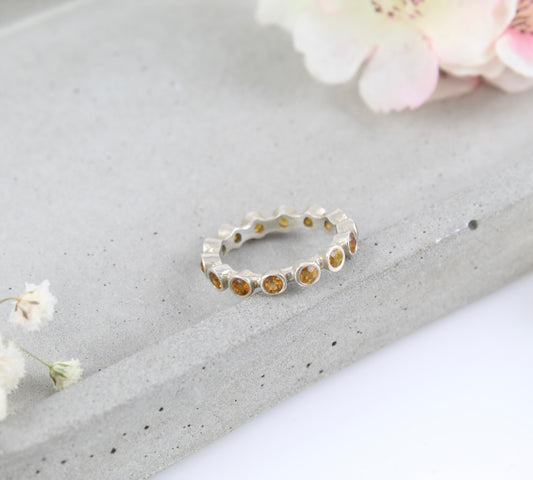 Silver and citrine eternity ring