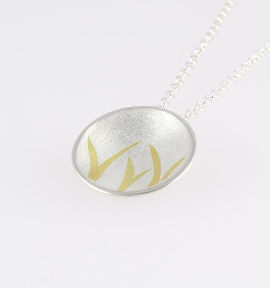 Domed Silver Pendant with gold detail